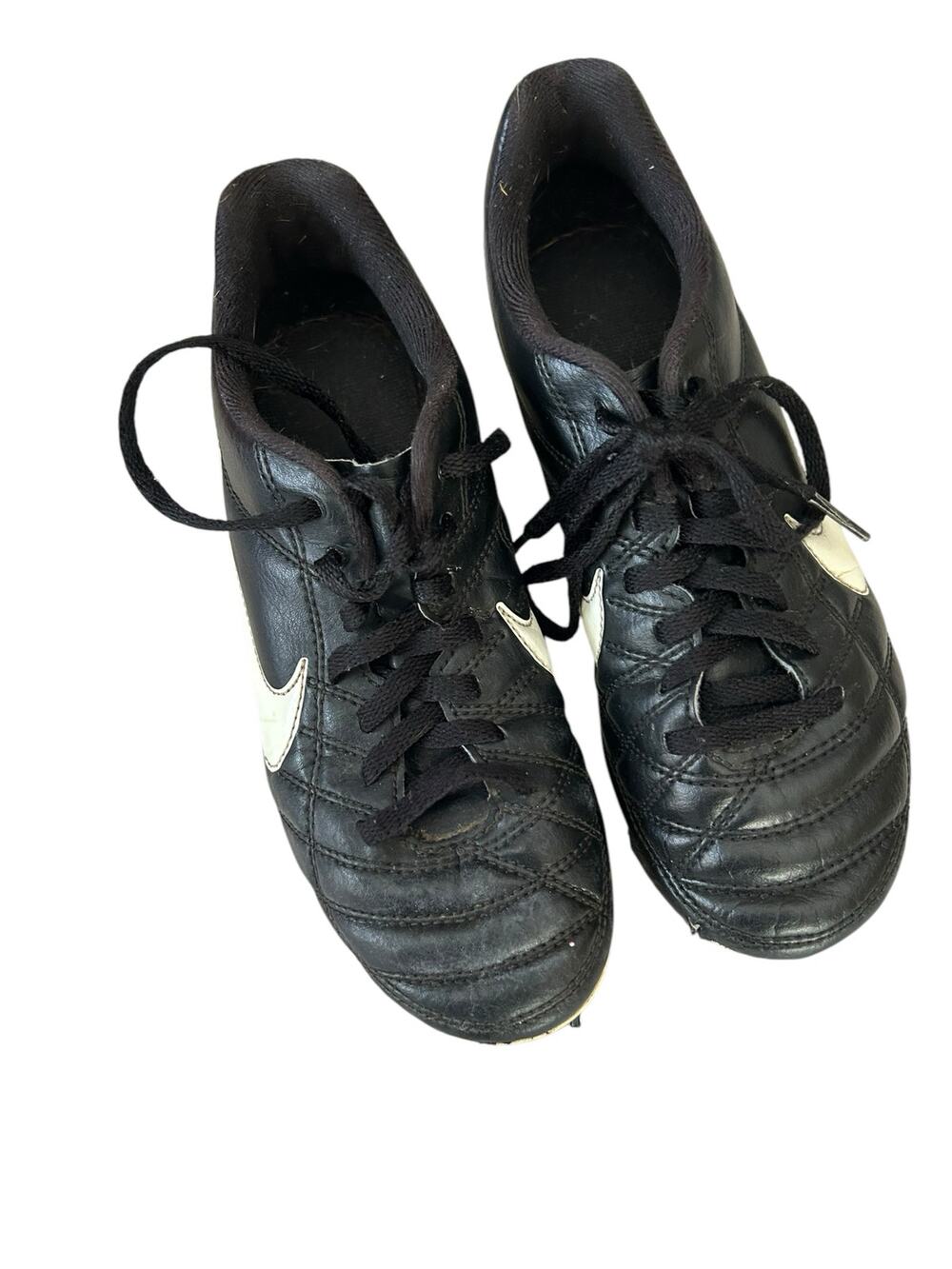 Nike black and white cleats size 2.5